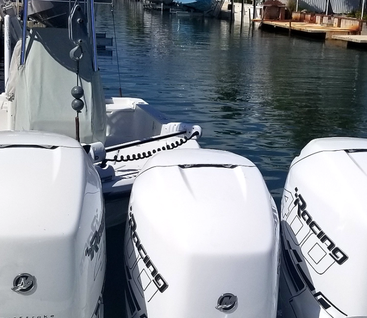 Boats lined along the river reflect boat maintenance services completed by Marine Kings of Miami.