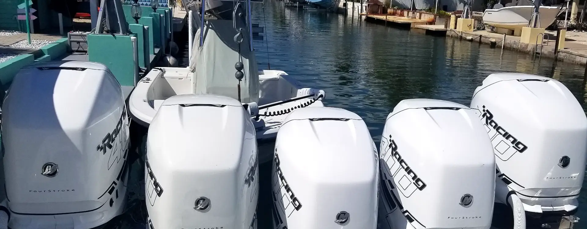 Boats lined along the river reflect boat maintenance services completed by Marine Kings of Miami.
