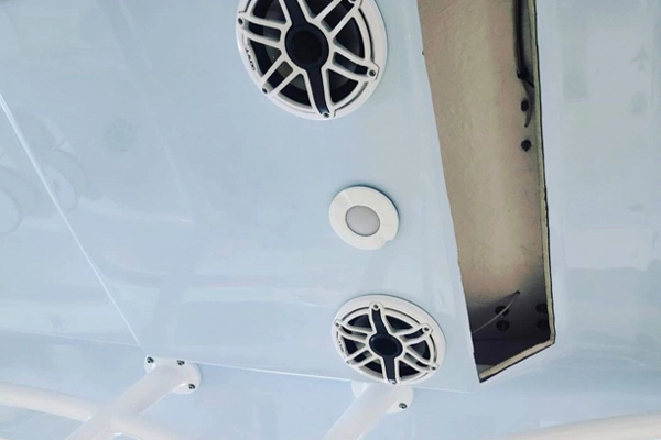 A boat with vents and exhaust outlets is serviced by Marine Kings of Miami with boat repair Miami.