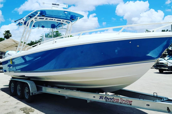  Transport on a trailer supports boat repair Miami handled by Marine Kings of Miami.