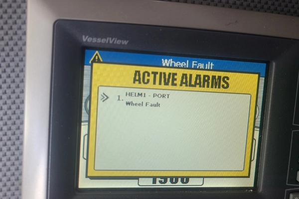 A screen on an electronic device is checked by Marine Kings of Miami using marine electrical troubleshooting in Miami, Florida.