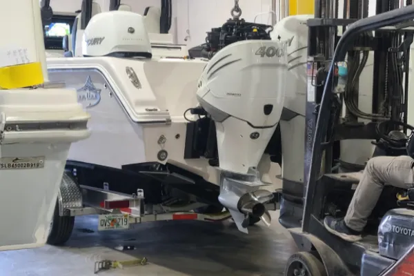  A technician on the floor performs boat maintenance services for Marine Kings of Miami.