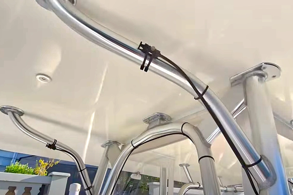  A white ceiling covers a workspace used by Marine Kings of Miami for boat maintenance services.