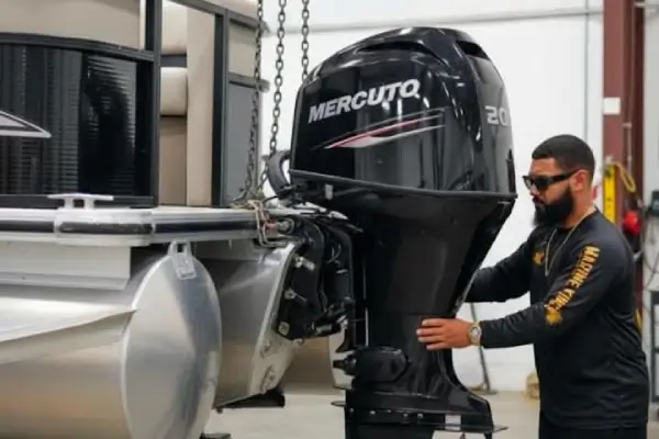  Inside the shop, a technician from Marine Kings of Miami performs boat maintenance services.