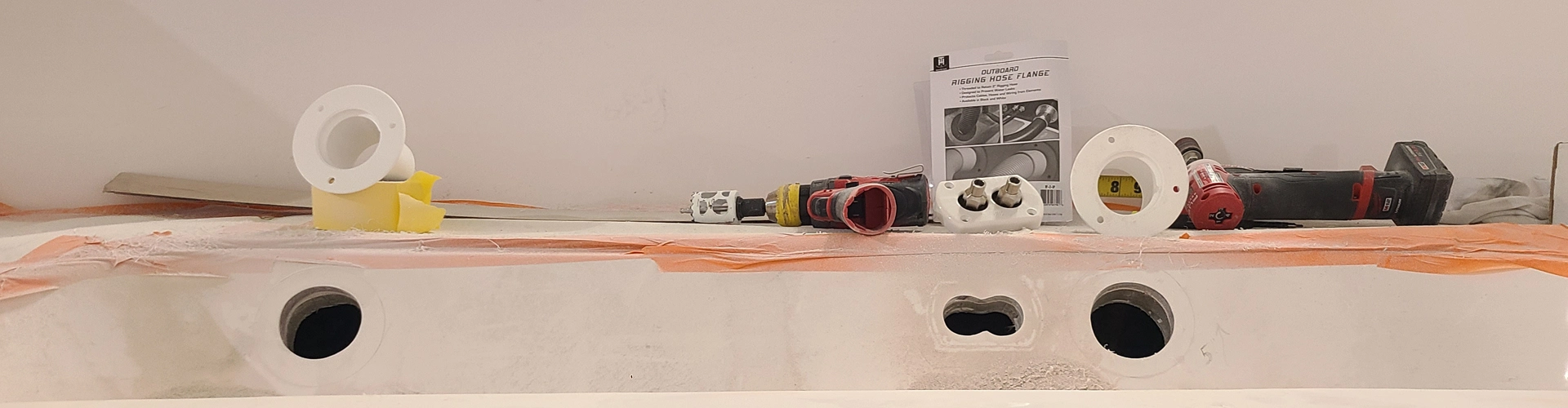 A white sink is installed by Marine Kings of Miami with boat maintenance services.