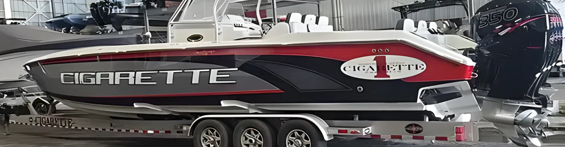 A boat being towed inside a garage is handled by Marine Kings of Miami with boat maintenance services in Miami, Florida.