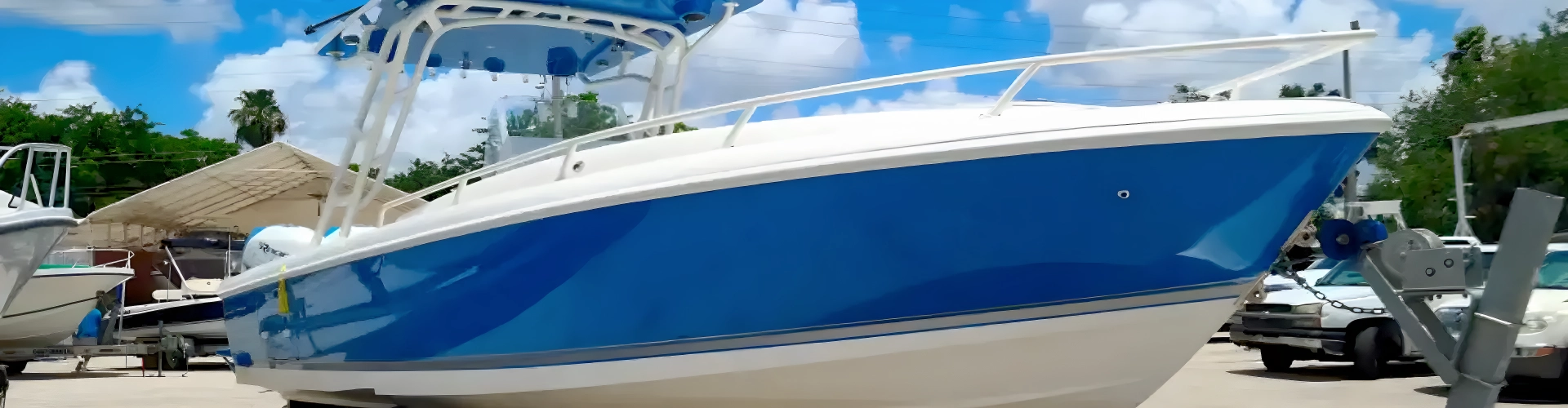  Another boat in the lot is serviced by Marine Kings of Miami with boat maintenance services.