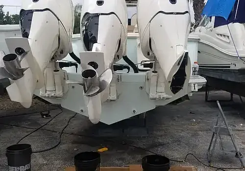  Two engines on the ground are serviced by Marine Kings of Miami with outboard engine service in Miami, Florida.