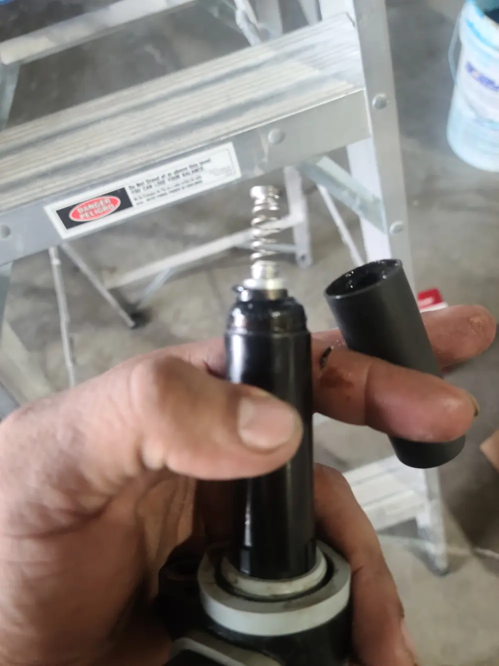 An electronic device in hand is checked by Marine Kings of Miami with marine electrical troubleshooting.