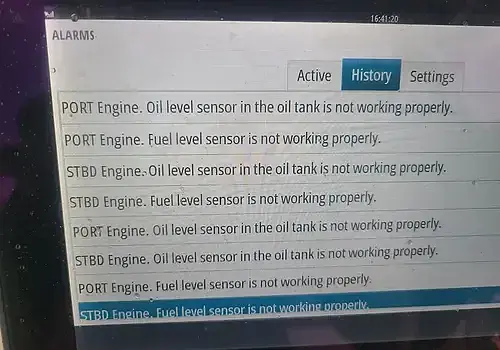 An electronic device in hand is tested by Marine Kings of Miami with marine electrical troubleshooting.
