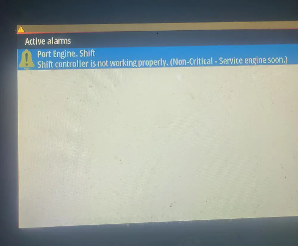  A computer screen message is reviewed by Marine Kings of Miami during marine electrical troubleshooting in Miami, Florida.