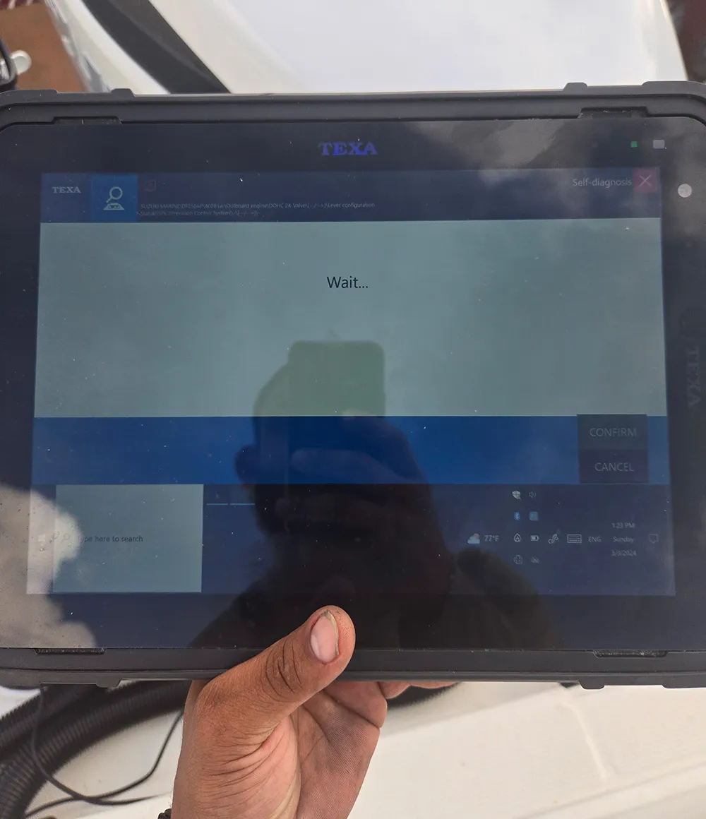 An open laptop is used by Marine Kings of Miami for marine electrical troubleshooting and diagnostics.