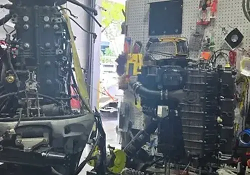 Trucks in a garage support operations for Marine Kings of Miami and boat repair Miami.