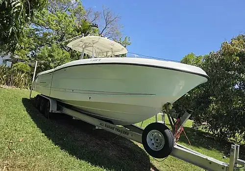 A trailer-mounted boat is handled by Marine Kings of Miami with boat repair Miami.