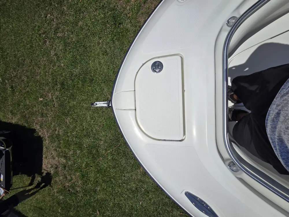  A small boat with an open door is serviced by Marine Kings of Miami with boat maintenance services in Miami, Florida.