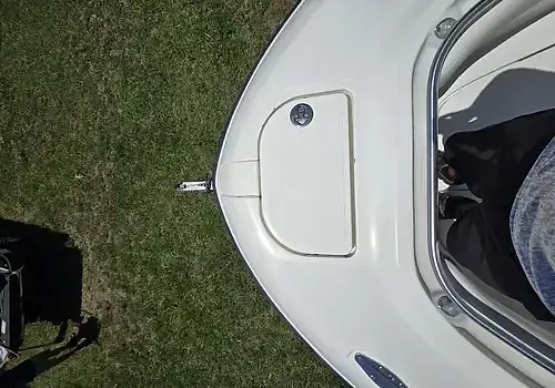  A small boat with an open door is serviced by Marine Kings of Miami with boat maintenance services in Miami, Florida.