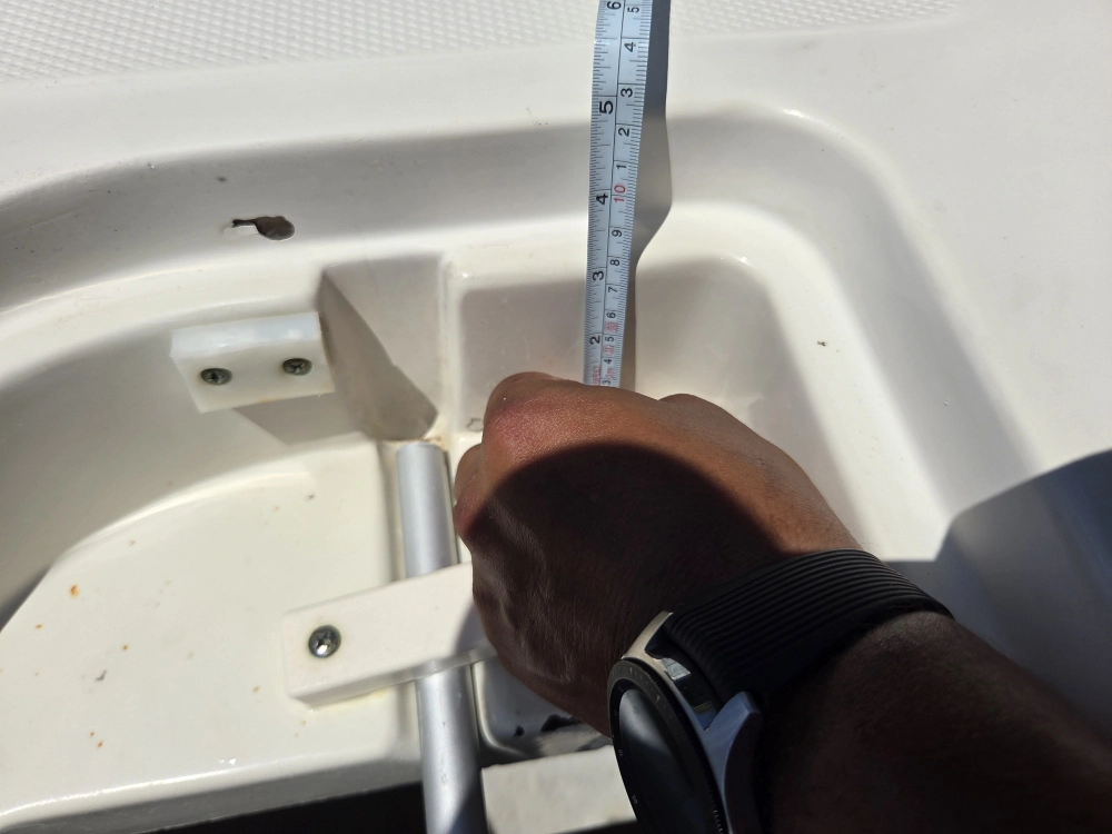Width measurements are taken by Marine Kings of Miami during boat maintenance services in Miami, Florida.