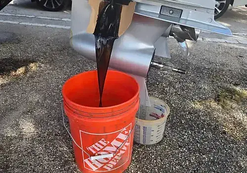 Paint pouring into a bucket reflects detailing work by Marine Kings of Miami in Miami, Florida.