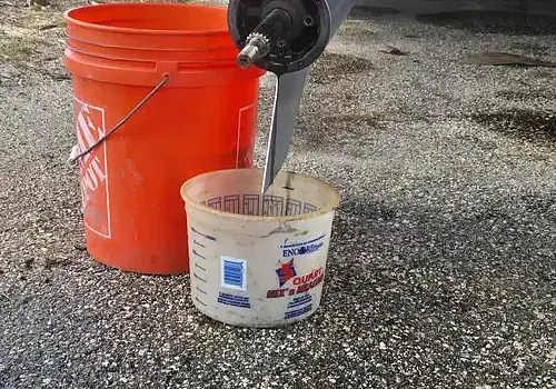 A paint bucket is used by Marine Kings of Miami during boat repair Miami.