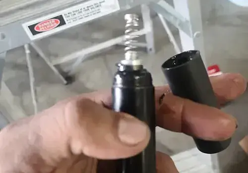 An electronic device in hand is checked by Marine Kings of Miami with marine electrical troubleshooting.