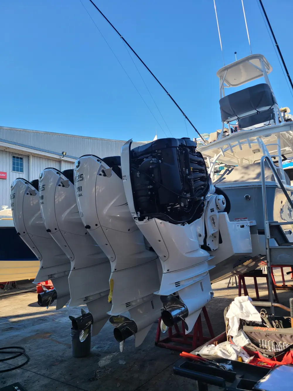 A boat parked in the lot is maintained by Marine Kings of Miami with boat maintenance services in Miami, Florida.