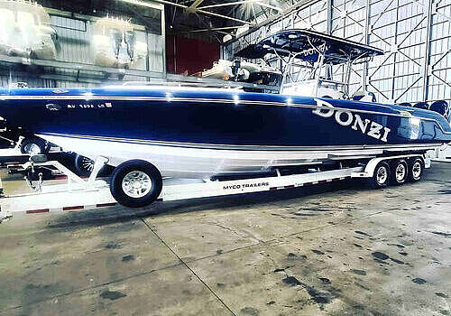  A vessel parked in the garage is serviced by Marine Kings of Miami with boat maintenance services.