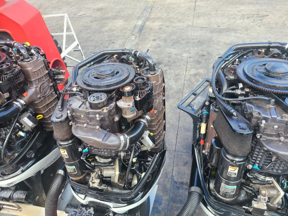 Two engines displayed are serviced by Marine Kings of Miami using marine engine diagnostics.