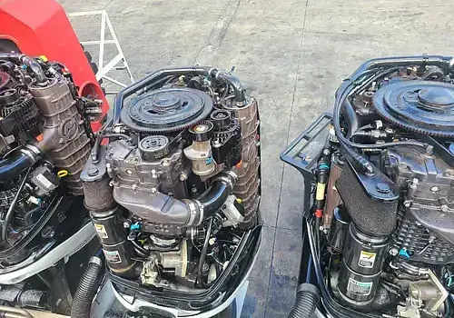 Two engines displayed are serviced by Marine Kings of Miami using marine engine diagnostics.