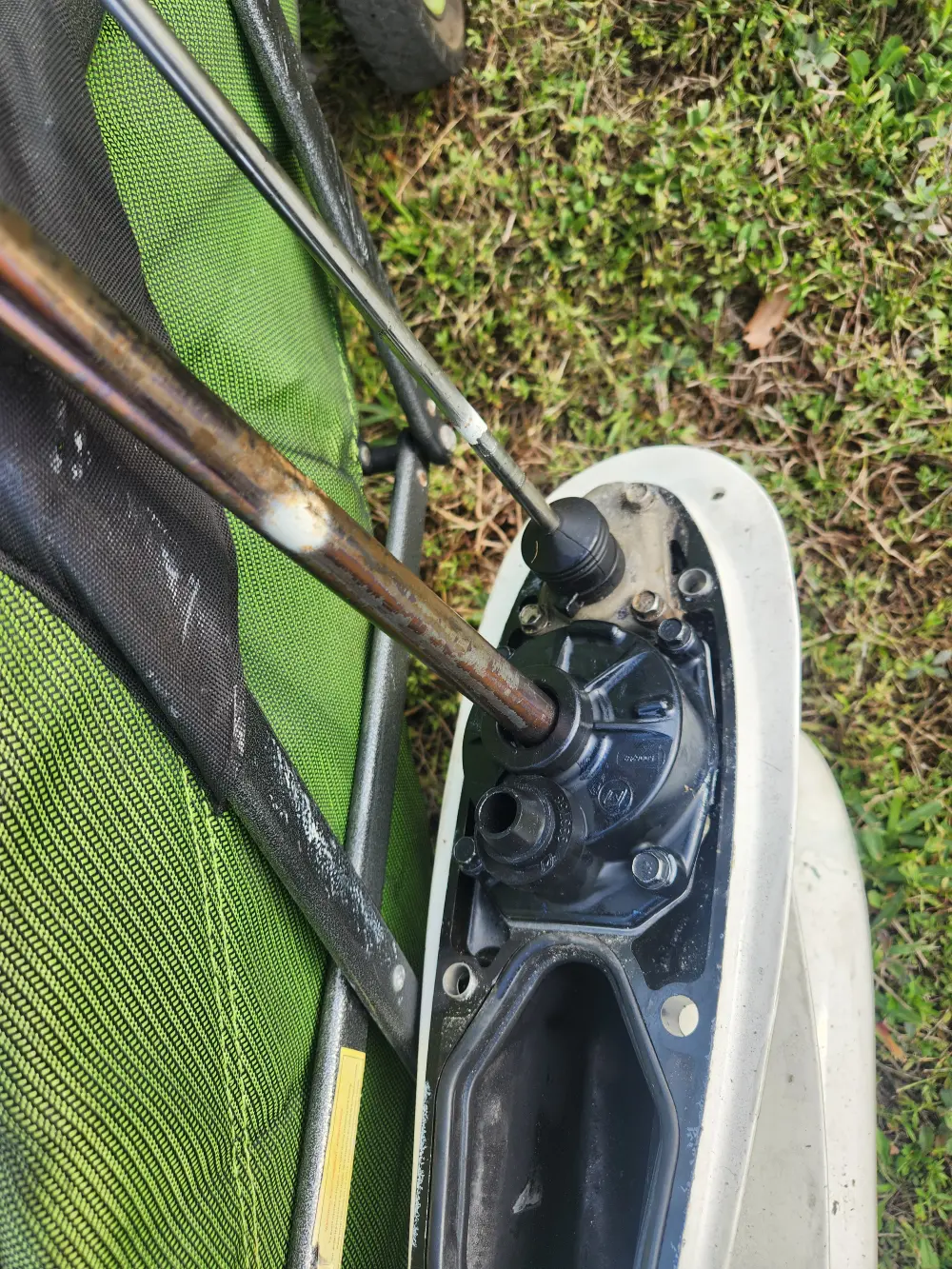  Walking outdoors, equipment carried is used by Marine Kings of Miami for boat maintenance services.
