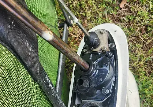  Walking outdoors, equipment carried is used by Marine Kings of Miami for boat maintenance services.