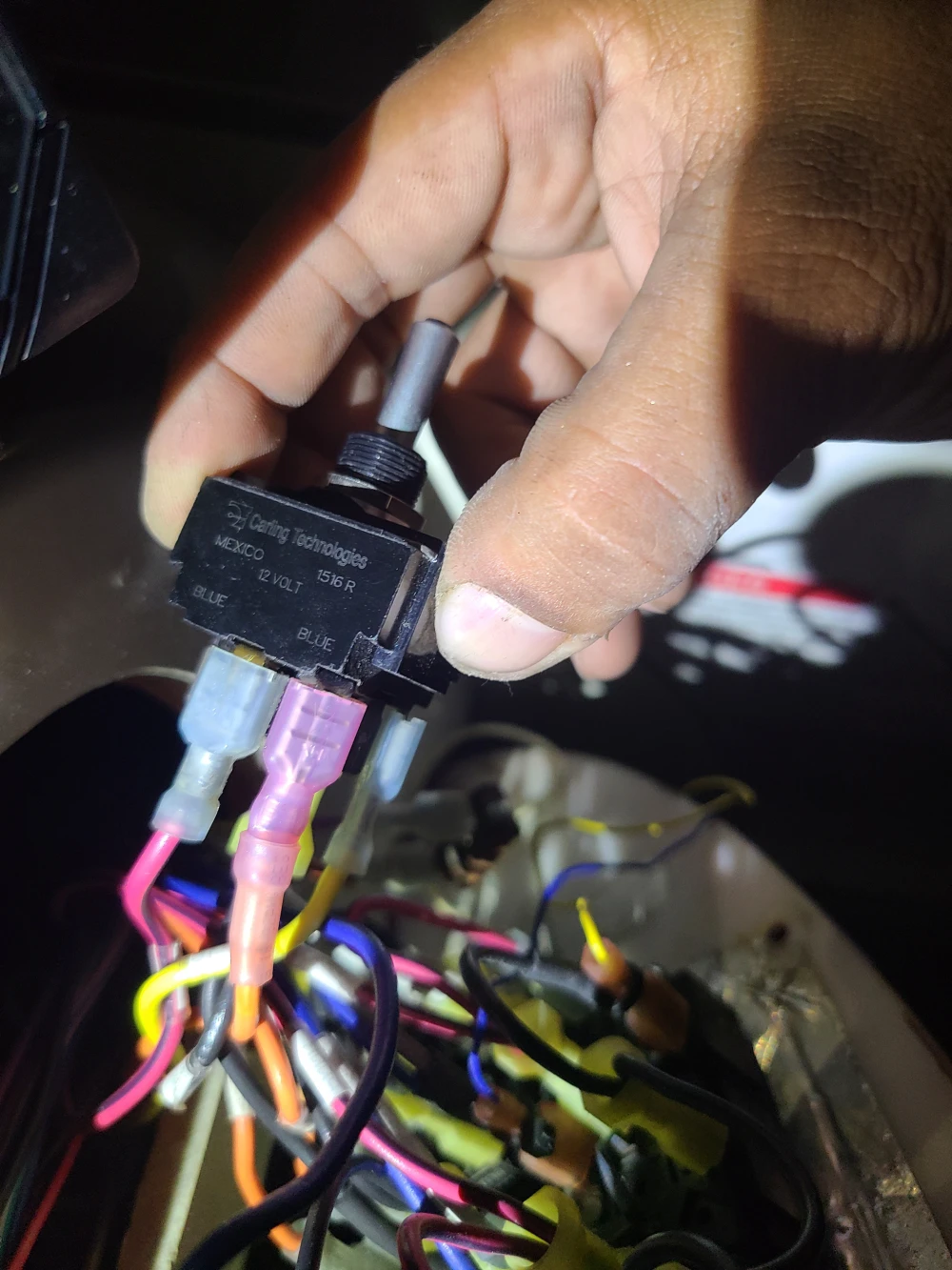 Wiring in hand is checked by Marine Kings of Miami with marine electrical troubleshooting.