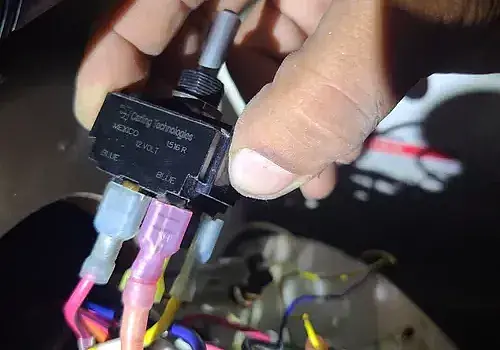 Wiring in hand is checked by Marine Kings of Miami with marine electrical troubleshooting.