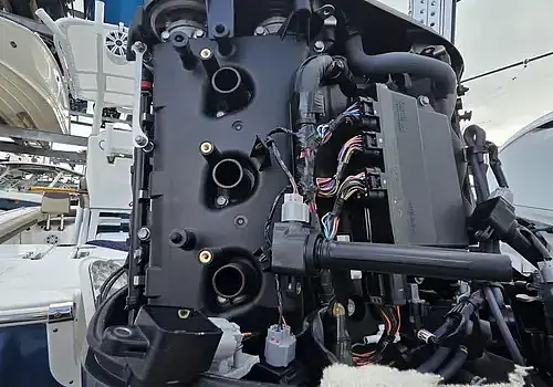 An engine with the hood open is inspected by Marine Kings of Miami using marine engine diagnostics.