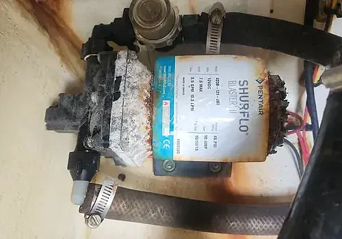 Alternator components are inspected by Marine Kings of Miami with marine engine diagnostics in Miami, Florida.