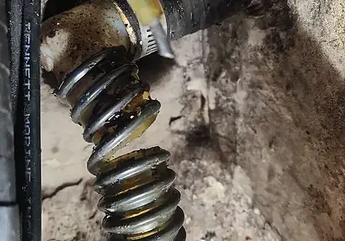 Suspension parts on a vehicle reflect mechanical work similar to boat repair Miami by Marine Kings of Miami.