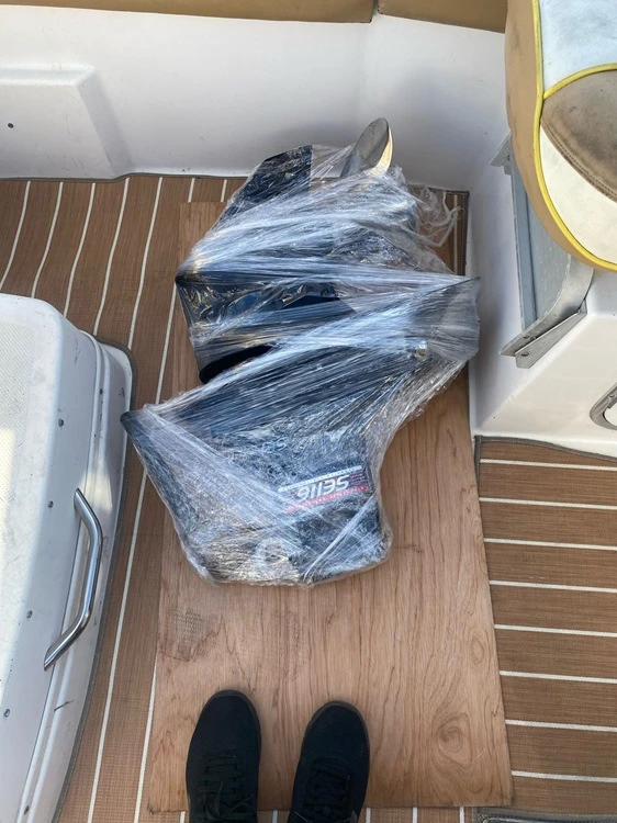  Plastic-covered decks are handled by Marine Kings of Miami with boat maintenance services.