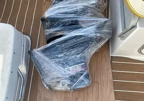  Plastic-covered decks are handled by Marine Kings of Miami with boat maintenance services.