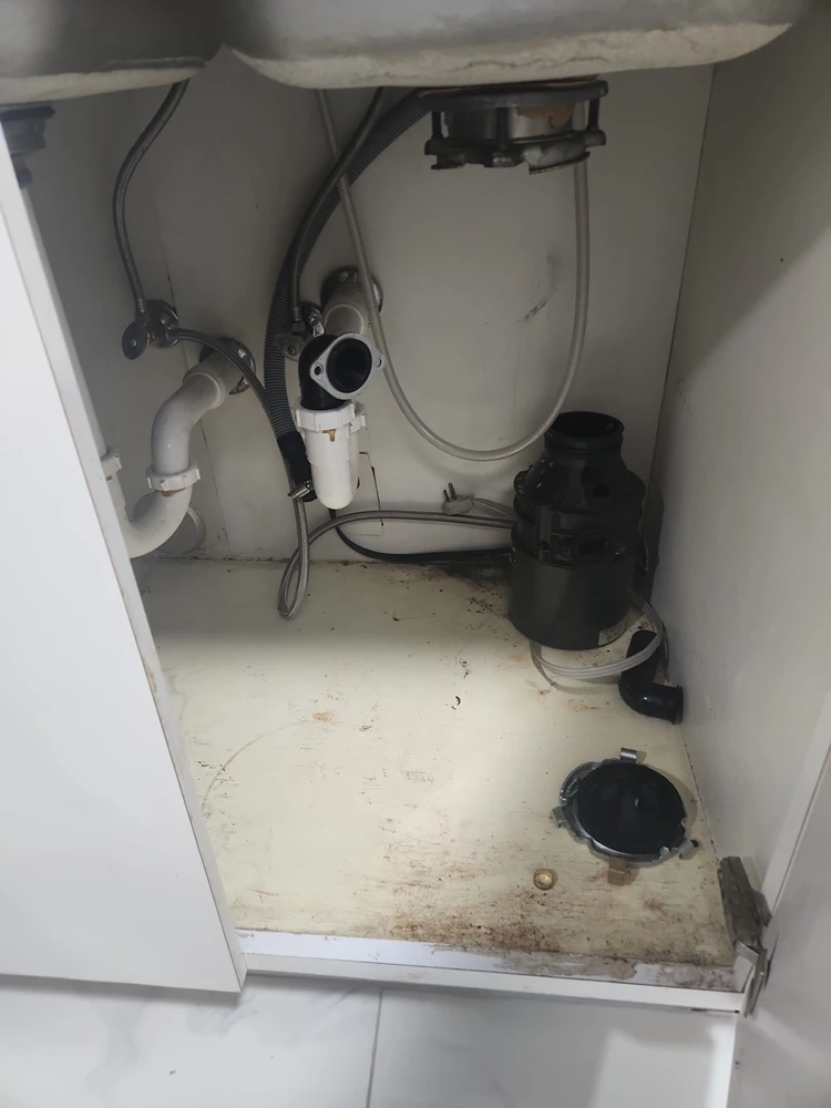 A bathroom with debris is cleaned and serviced by Marine Kings of Miami with plumbing services in Miami, Florida.
