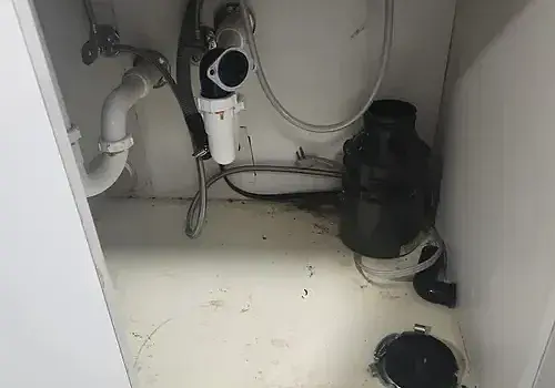 A bathroom with debris is cleaned and serviced by Marine Kings of Miami with plumbing services in Miami, Florida.