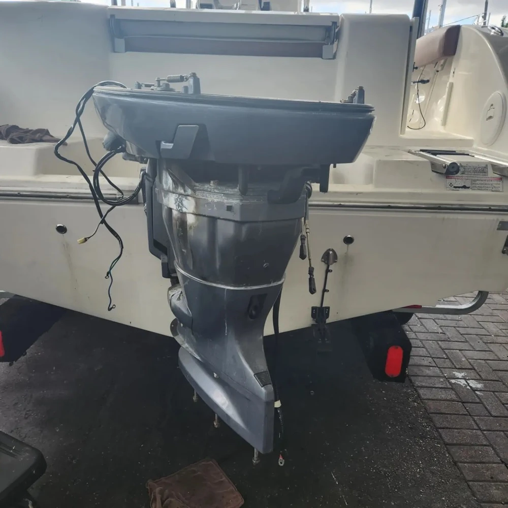 A boat engine is serviced by Marine Kings of Miami with outboard engine service.