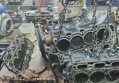 Engine parts in a workshop are used by Marine Kings of Miami for marine engine diagnostics in Miami, Florida.