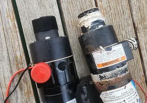  A small pump with a hose is used by Marine Kings of Miami for boat maintenance services.