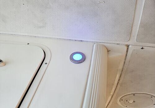 A refrigerator in a kitchen reflects spaces supported by Marine Kings of Miami with plumbing services in Miami, Florida.