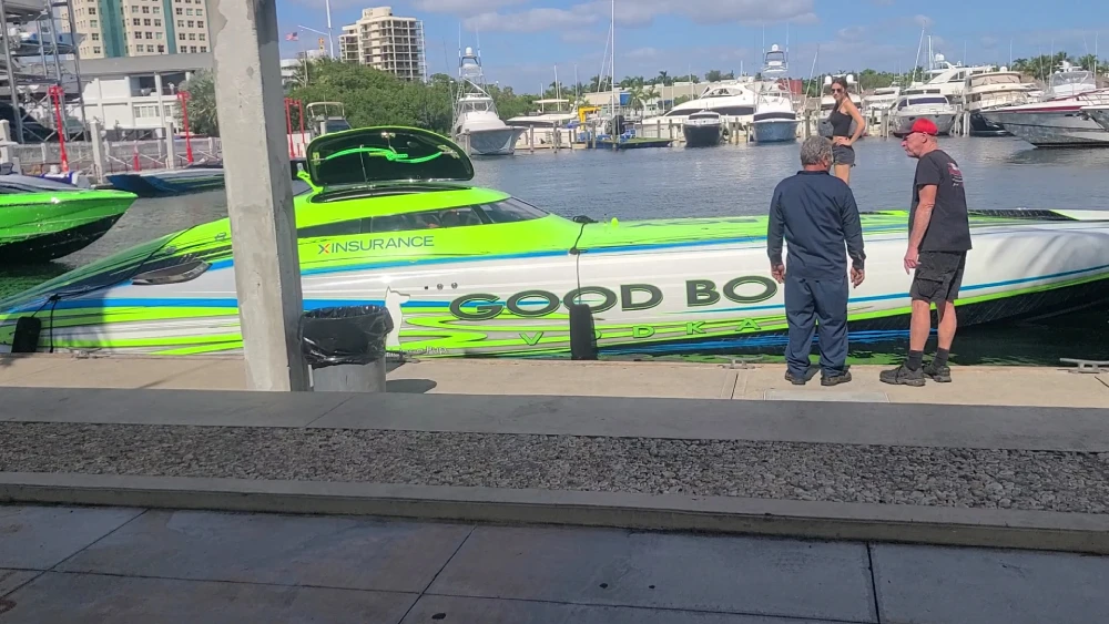 Standing near the water, a technician from Marine Kings of Miami prepares for boat maintenance services in Miami, Florida.