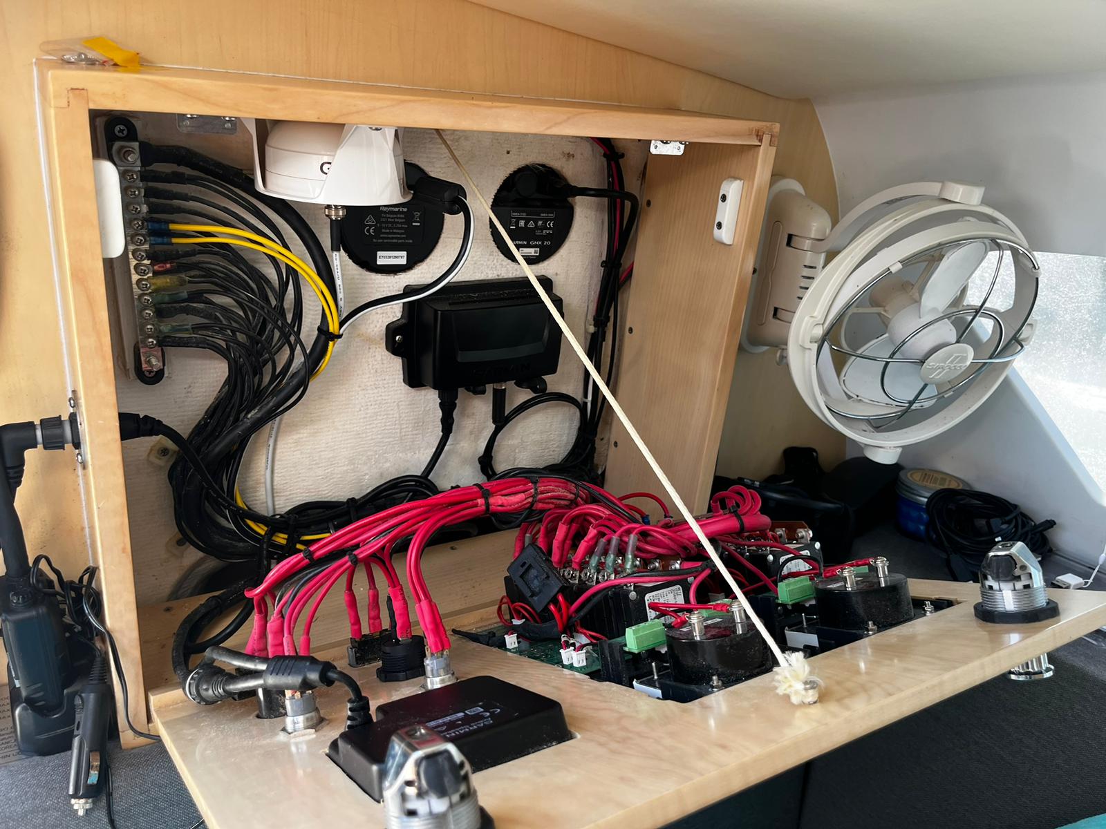 A small boat with electronics is serviced by Marine Kings of Miami with marine electrical troubleshooting in Miami, Florida.