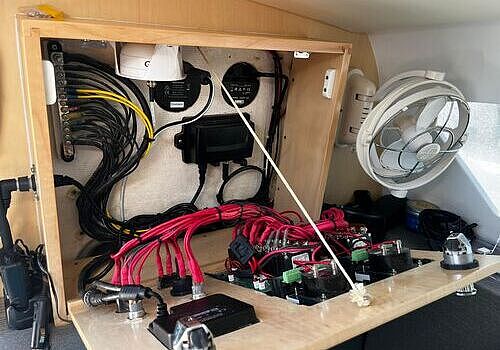 A small boat with electronics is serviced by Marine Kings of Miami with marine electrical troubleshooting in Miami, Florida.