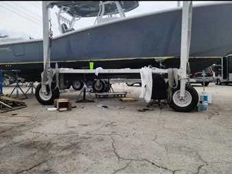 A boat being towed on land is transported for boat repair Miami by Marine Kings of Miami in Miami, Florida.