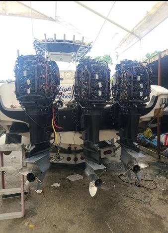 Four engines on a boat are serviced by Marine Kings of Miami using marine engine diagnostics in Miami, Florida.