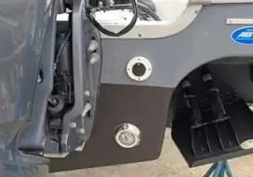 Removing a bumper with tools reflects mechanical skills used by Marine Kings of Miami for boat repair Miami.