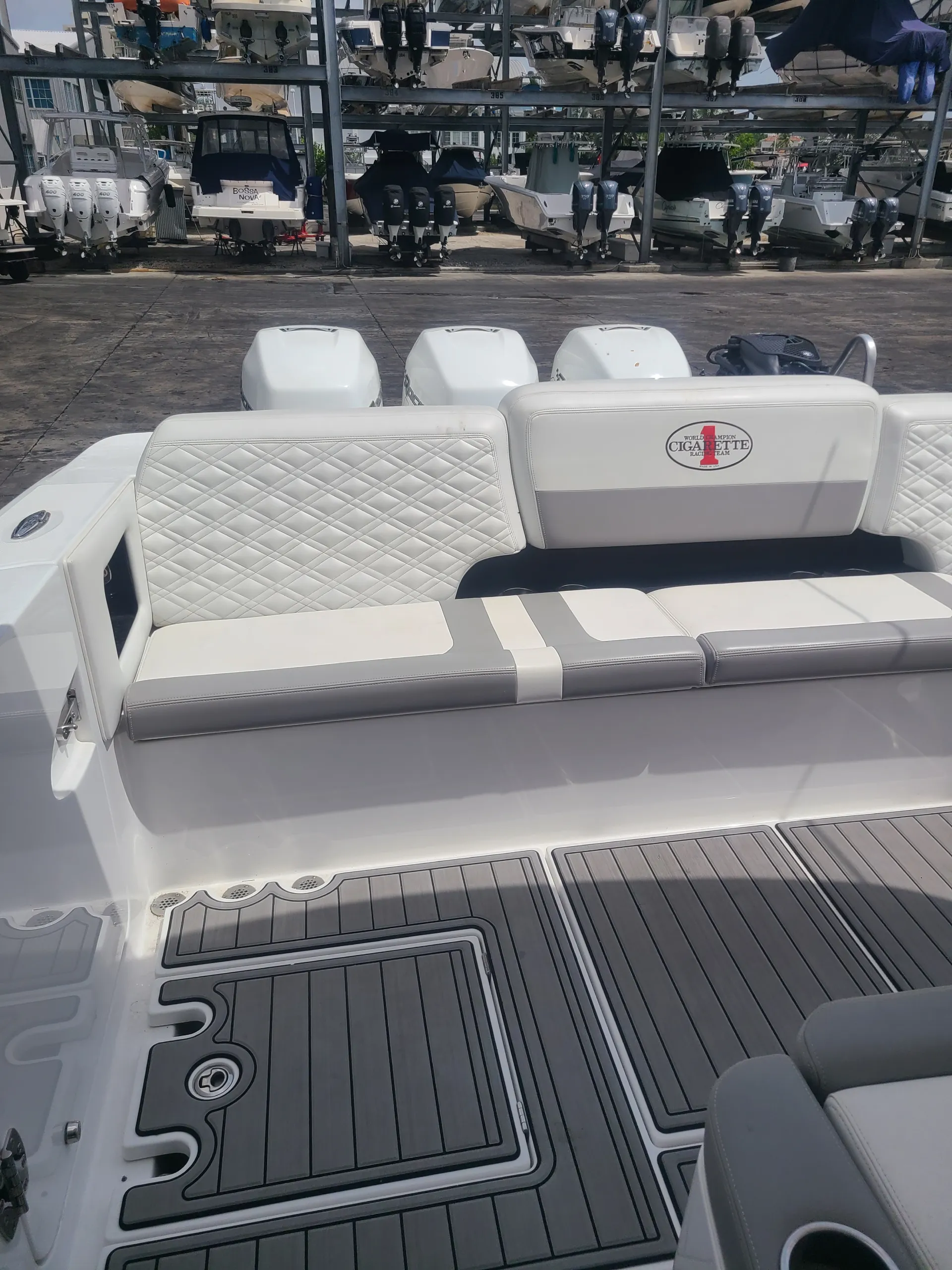  A white boat with seating is serviced by Marine Kings of Miami with boat maintenance services in Miami, Florida.